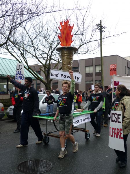 Richard Cunningham (left torch bearer) says he was inspired to participate in the Poverty Olympics Torch Relay to help stop the discrimmination against homeless people // Esther Hsieh