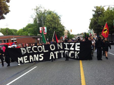 Confronting Canada Day marches down Commercial Drive in East Vancouver, July 1, 2014