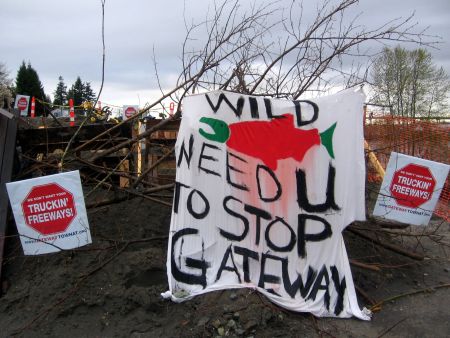 A banner placed on the barricades at the South Fraser Protection Camp. Photo: Sandra Cuffe
