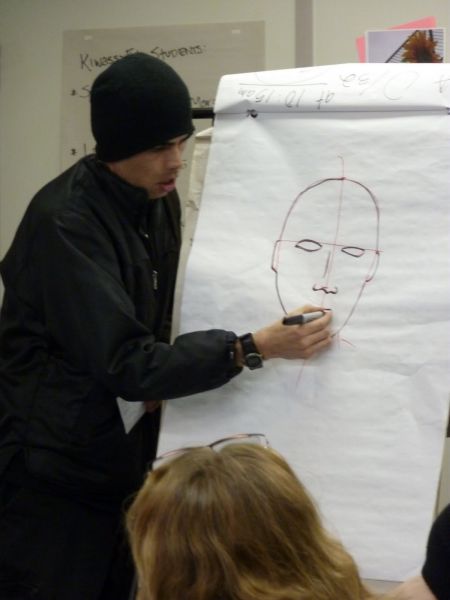 Gord Hill teaches attendees a quick way to sketch faces