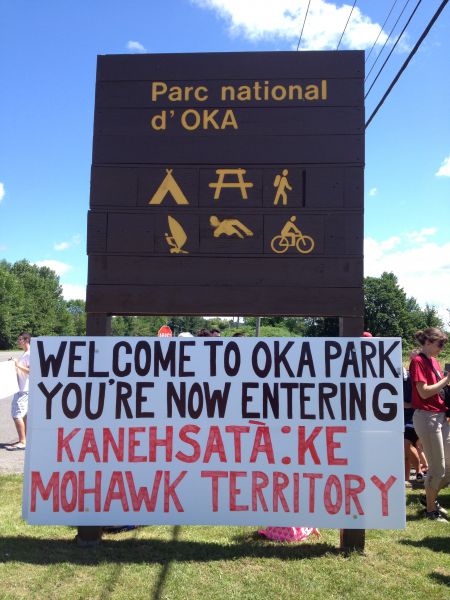 A sign at the entrance to Parc Nationale d’Oka, where Kanien’kehá:ka artifacts are being excavated by archaeologists without community consent. Photo by Ellen Gabriel.