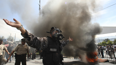A cop protests in Ecuador, photo stolen from Reuters