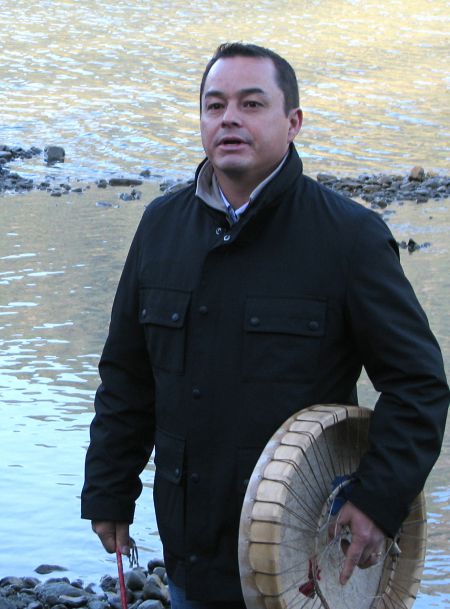 AFN National Chief addressing wild salmon paddlers on the FRaser River shore, 2010.