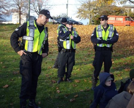 At the initial rally point at China Creek Park, members of the VPD "public safety unit" attempt to lecture the protesters about conduct during the action.