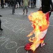 Festive rally holds/blocks 12th & Clark - burning Canadian flag