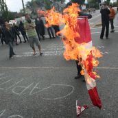 Festive rally holds/blocks 12th & Clark - burning of Canadian flag