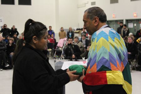 Kelly White presents Commissioner Wally Oppal with a bundle. Photo: Tami Starlight