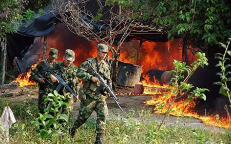 Colombia: paramilitary forces raze village infrastructure. Photo from UK Telegraph.