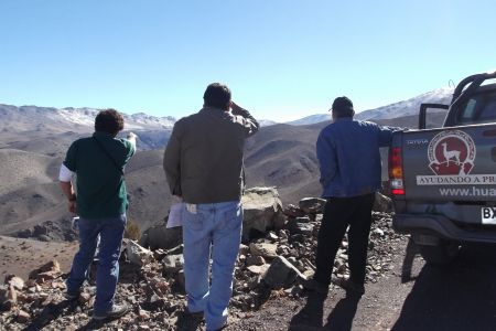 Three men from the Diaguita Huascoaltinos Indigenous and Agricultural Community overlook the area which would be destroyed by the El Morro mine in Chile. Photo: Sergio Campusano.