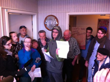Tenants hold up the letter they received from the Mount Pleasant Housing Society