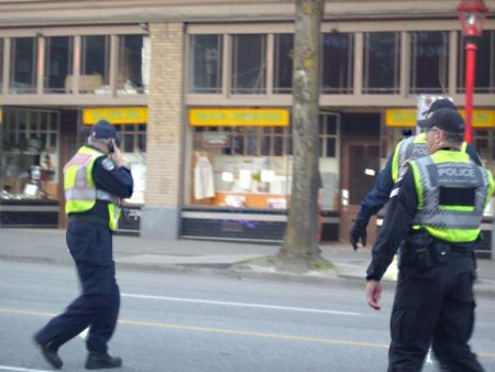 These are two commanders of the PSU (both Sergeants) and a member of the fire department (with red lettering on the back of his reflective vest).  The fire department is also part of the PSU.