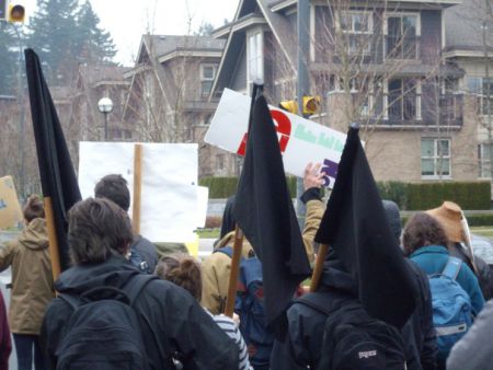Anarchist black flags on the march.