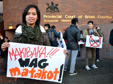 Krystle Alarcon of the Philippine Women's Centre led the rally in this Tagalog chant, which roughly translated means "Dare to struggle, never be afraid!" <i>murray bush - flux photo</i>