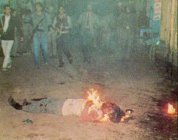  A Sikh youth being burned alive during the Sikh Genocide in India in 1984. 