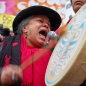 Downtown eastside activist sings a First Nation song at the rally