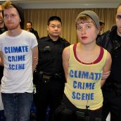 Climate justice activists Peter Oxford and Fiona De Balaszi Brown cuffed.