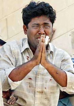 A young Muslim in Gujarat begging with tears not to harm him and his family, during the 2002 Gujarat massacre of muslims in India.