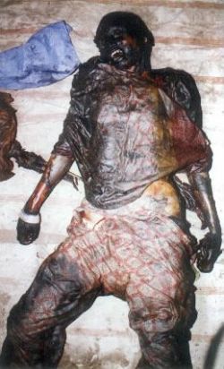 Charred remains of a Muslim woman in Gujarat state. The result of Genocide  under the leadership of Narindra Modi.
