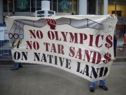 Banner displayed during anti-olympic rally on May 2009